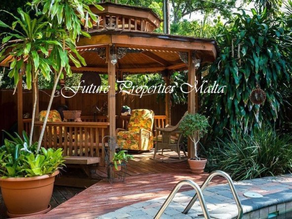 tropical-patio-with-cedar-octagon-gazebo-12-foot-diameter-next-to-pool